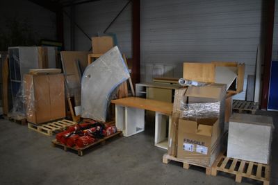 a lot of boxes that are sitting in a warehouse