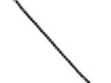 a close up of a black and white bracelet on a white background
