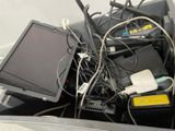 a lot of wires and electronics in a bin