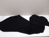 a pair of black pants sitting on a white table