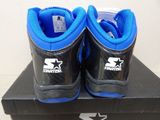 a pair of blue and black shoes on a box