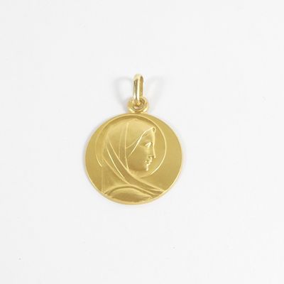 a close up of a gold coin with a woman ' s face on it