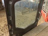 a close up of a window on a truck in a barn