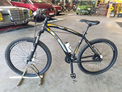 a bicycle that is parked in a garage