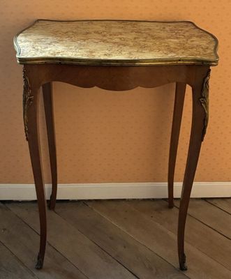 a small table with a mirror on top of it