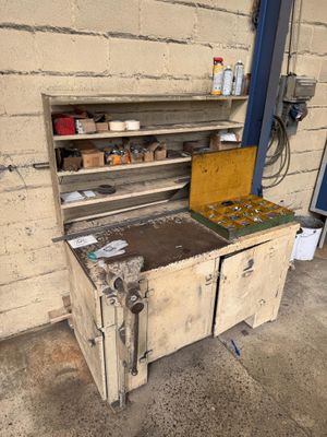 an old stove with a wooden cabinet in the middle of it