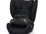 un siège auto pour bébé noir équipé d'une ceinture de sécurité verte