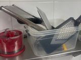 a lot of kitchen utensils that are on the counter