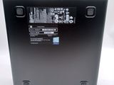 the back of a laptop with a black back panel and a white back panel
