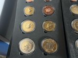 a lot of coins that are in a black box