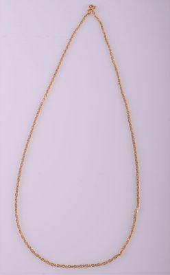 a gold chain necklace with a heart pendant on a white background