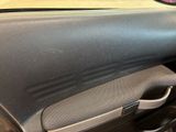 a close up of a car ' s dashboard with the door handle open