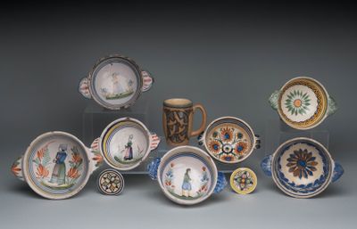 many plates and cups that are sitting on a table