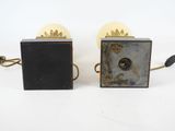 pair of vintage brass and black lamps with glass shades