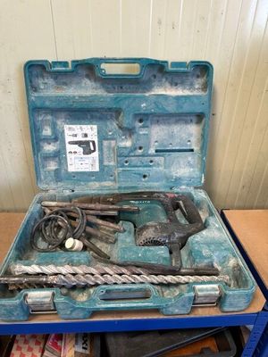 a blue tool case with tools in it on a table