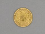 l'image d'une pièce d'or portant une croix