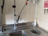 a sink and a faucet in a small kitchen