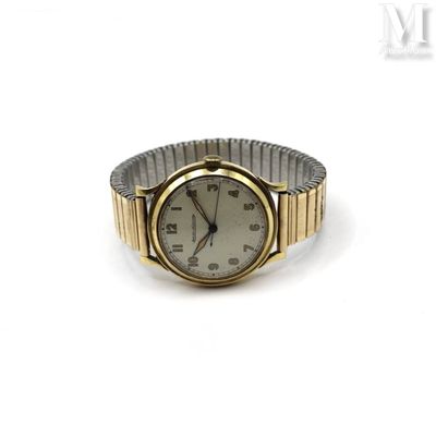 a close up of a watch on a white surface with a white background