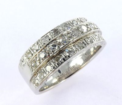 a close up of a diamond ring on a white background