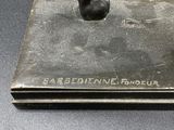 a statue of a man holding a baseball bat on top of a base