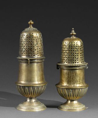 pair of antique brass salt and pepper shakers