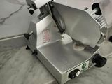 an image of a commercial meat slicer on a counter