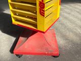 a red and yellow cart with a yellow sign on it