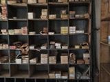 a room filled with lots of boxes and boxes on the shelves