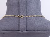 a close up of a mannequin with a gold chain on it