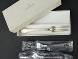 silverware in a white box with a silver spoon and fork