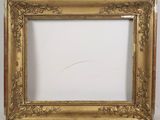 a gold picture frame with a white background
