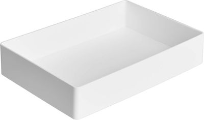a close up of a white sink on a white background
