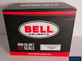a box of bell helmets that is on a table