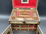 an old wooden jewelry box with a mirror and drawers inside