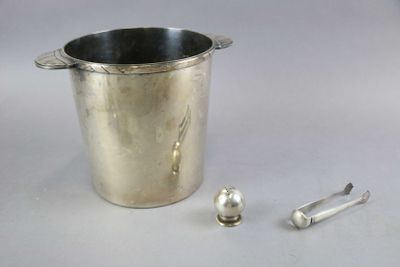a silver bucket with a spoon and spoon rest next to it