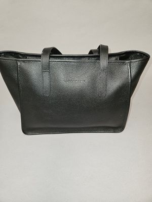 a black leather handbag on a white background