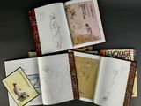 a lot of books that are sitting on a table