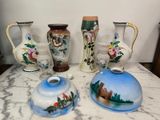 three vases on the table and one has a bear on it