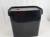a black container sitting on a white surface