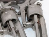 two revolvers that are sitting on a table