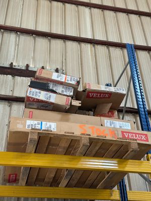 many boxes stacked on a pallet in a warehouse
