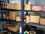 many boxes and boxes on the shelves in the room