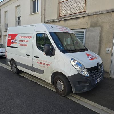 a white van that is parked on the side of the street