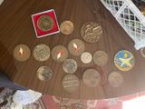 a lot of coins sitting on a table on the floor