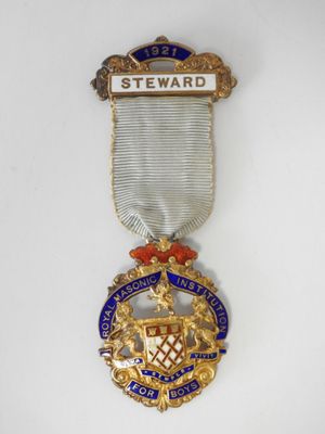 a close up of a medal on a white surface
