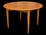 an image of a round wooden table with a black background