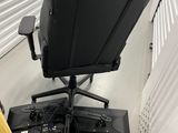 an image of a computer chair with a baseball bat on it