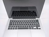 a close up of a laptop computer on a white surface
