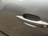a door handle on a car that has a sticker on it