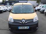 a small yellow van parked in a parking lot